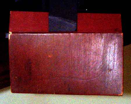 [ Picture of the cover of the mystery box, showing a very faint Monopoly® script ]
